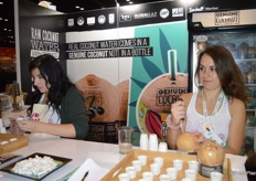 Ready-to-drink coconuts are prepared for Fresh Summit attendees.